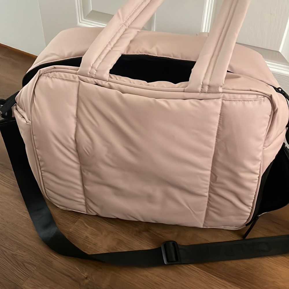 Pink calpak carry on